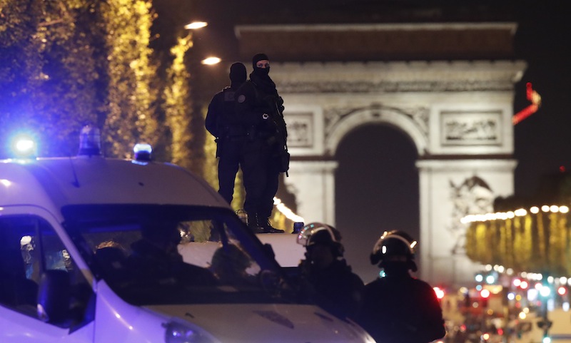 Masked police stand on top of their vehicle on the Champs Elysees Avenue after two policemen were killed and another wounded in a shooting incident in Paris, France, April 20, 2017. u00e2u20acu201d Reuters pic 