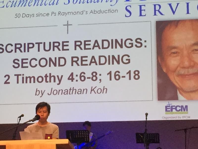 Pastor Raymond Koh’s son, Jonathan, speaks at the service. 