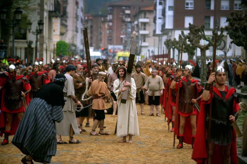 Jesus Christ (centre), played by local Ander Rivero, carries his cross during a Via Crucis representation on Good Friday, in the Basque town of Balmaseda April 14, 2017. u00e2u20acu201d Reuters pic