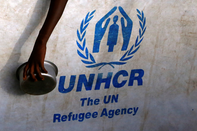 South Sudanese refugee displaced by fighting holds a utensil as he waits for a warm meal at Imvepi settlement in Arua district, northern Uganda April 4, 2017. — Reuters pic