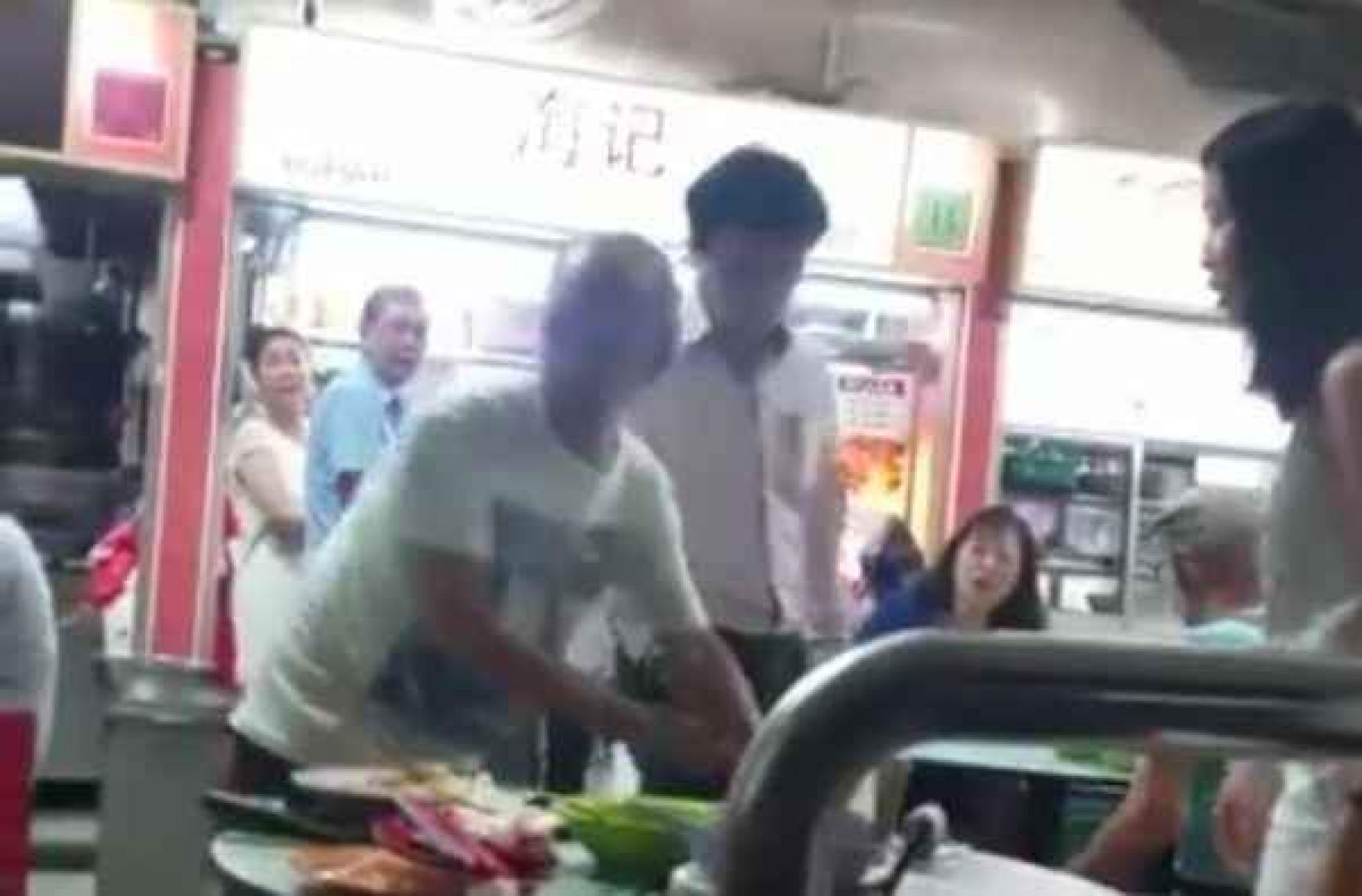 A screengrab from YouTube video showing a man pushing and elderly-man at a hawker centre in Toa Payoh, Singapore. 