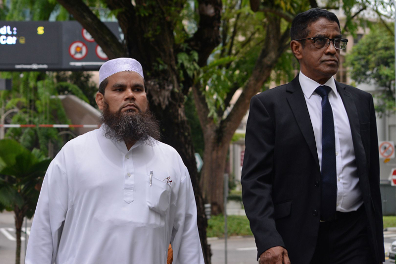 Imam Nalla Mohamed Abdul Jameel Abdul Malik (left) and his lawyer outside the courts in Singapore April 3, 2017. u00e2u20acu201d Picture by Robin Choo/TODAY