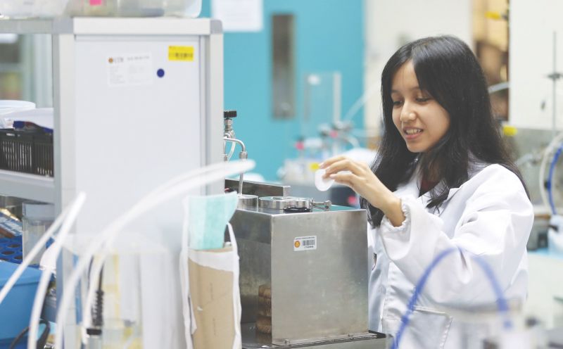 Nurul Shahirah Mohd Sabri, 24, a Master’s degree student in Chemical Engineering checks the performance of membranes at the Advanced Membrane Technology Research Centre, UTM.
