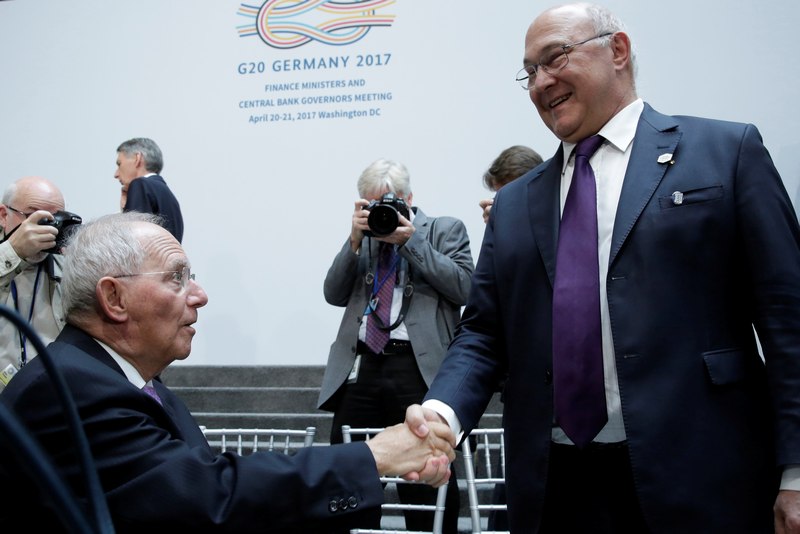 German Finance Minister Wolfgang Schaeuble (left) shakes hands with French Finance Minister Michel Sapin after G-20 family photo during the IMF/World Bank spring meetings in Washington April 21, 2017. u00e2u20acu201d Reuters pic