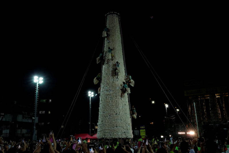 People take part in a bun scrambling competition during Bun Festival at Cheung Chau island in Hong Kong May 4, 2017. u00e2u20acu201d Reuters pic