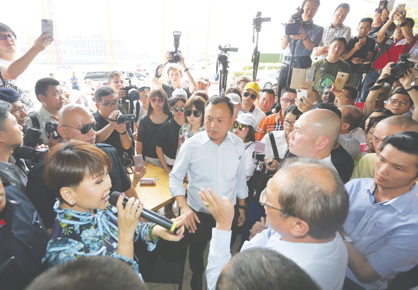 Lim (top right) and Liu demand an explanation from Lai over the status of her company. u00e2u20acu201d Picture by Razak Ghazali