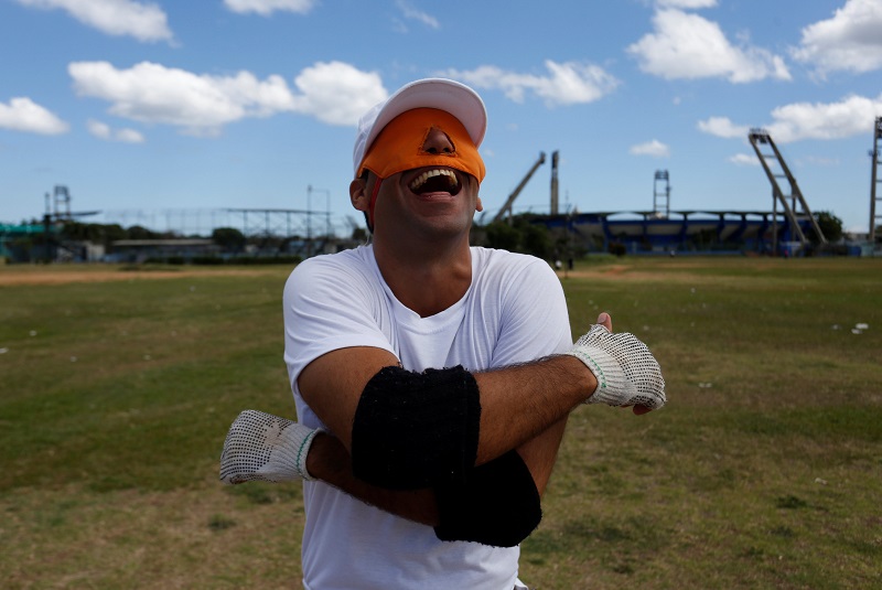 Carlos Miguel Lorenzo, who is visually impaired, reacts during a baseball lesson at the Changa Medero stadium, in Havana  May 17, 2017. u00e2u20acu201d Reuters pic