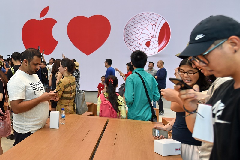 People visit the Apple store in the Orchard shopping district on its opening day in Singapore on May 27, 2017. u00e2u20acu201d AFP pic