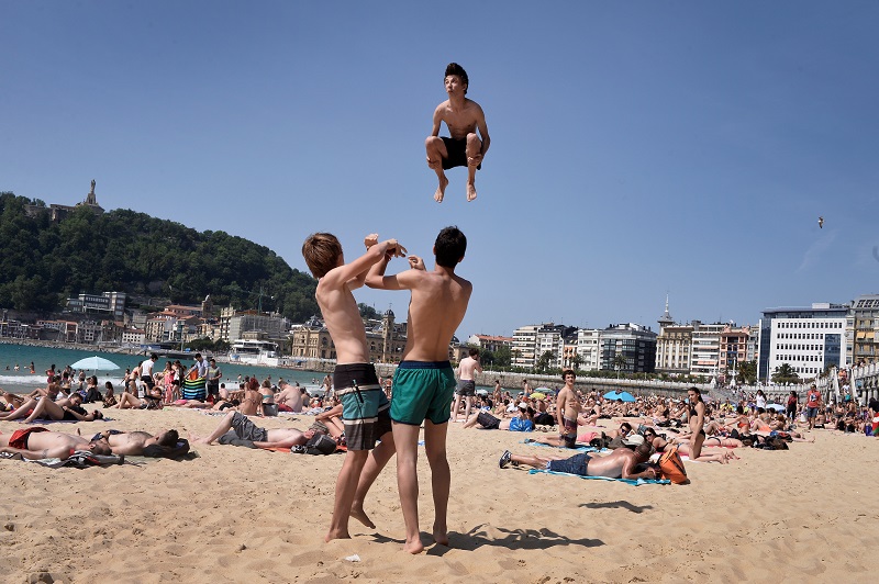 Beachgoers perform acrobatics on La Concha beach in the Basque city of San Sebastian May 26, 2017. u00e2u20acu201d Reuters pic