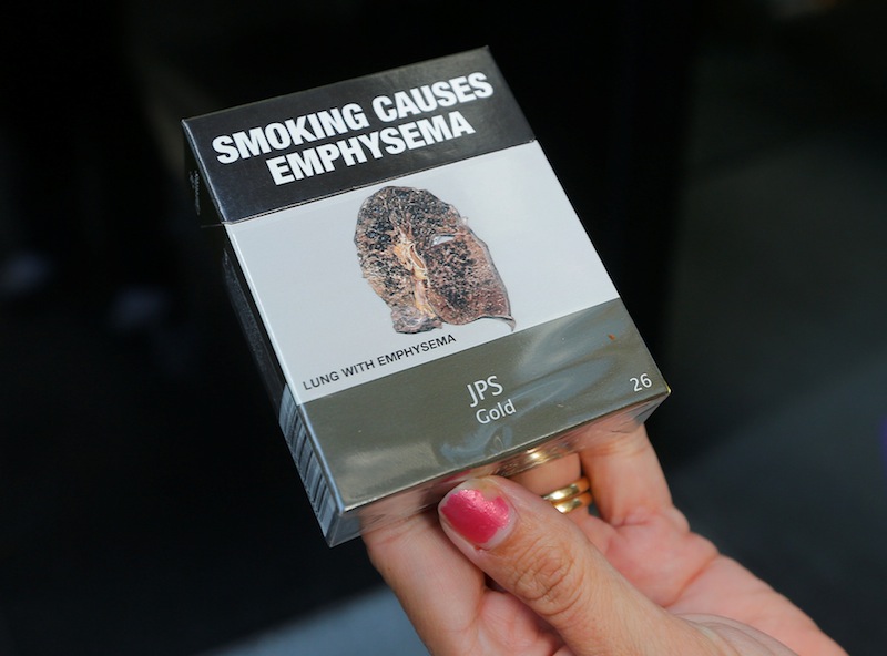 A photo illustration shows restrictive tobacco packaging on cigarettes outside a Sydney office building in Australia, May 5, 2017. u00e2u20acu201d Reuters pic