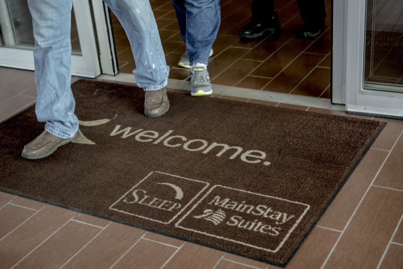 A welcome mat at the Sleep Inn/MainStay Suites in Meridian, Mississippi. u00e2u20acu2022 Picture by Andrea Morales/The New York Times