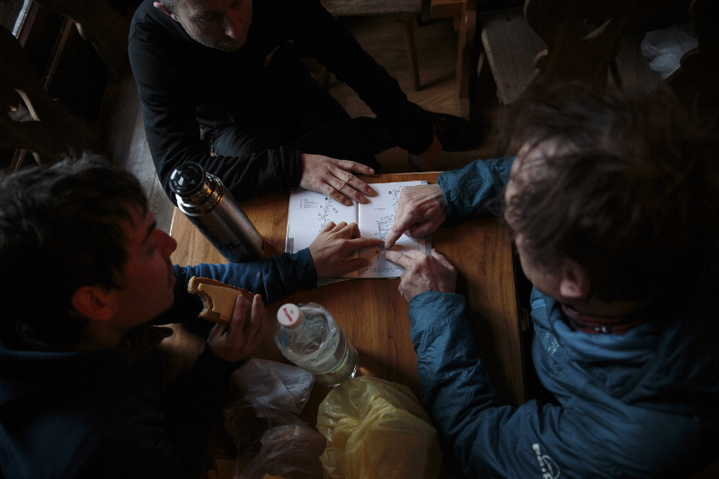 (From left)  Kacper Tekieli, Piotr Tomala and Janusz Golab plot a route for a day of climbing in the Tatra Mountains January 10, 2017. They are among a group planning what would be a first-ever winter ascent of K2.