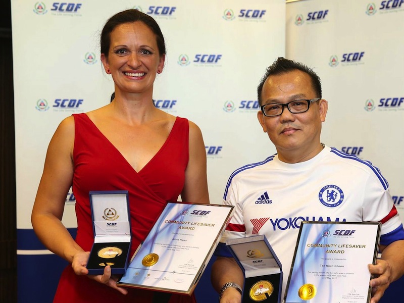Silvia Hajas and Tan Kian Choon receiving the Community Lifesaver Award. u00e2u20acu201d Picture by Wee Teck Hian/TODAY