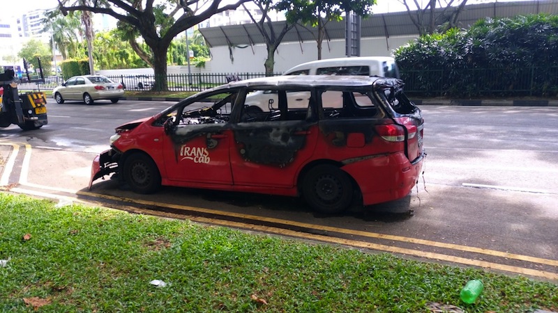 The TransCab taxi that caught fire on Monday. u00e2u20acu201d Picture by Faris Mokhtar/TODAY