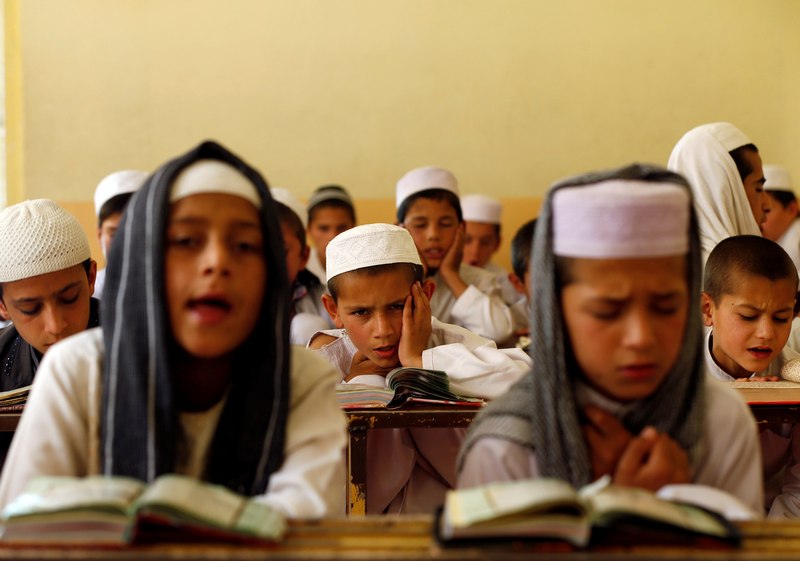 Afghan boys read the Quran in a madrasa, or religious school, during the Muslim holy month of Ramadan in Kabul May 28, 2017. u00e2u20acu201d Reuters pic