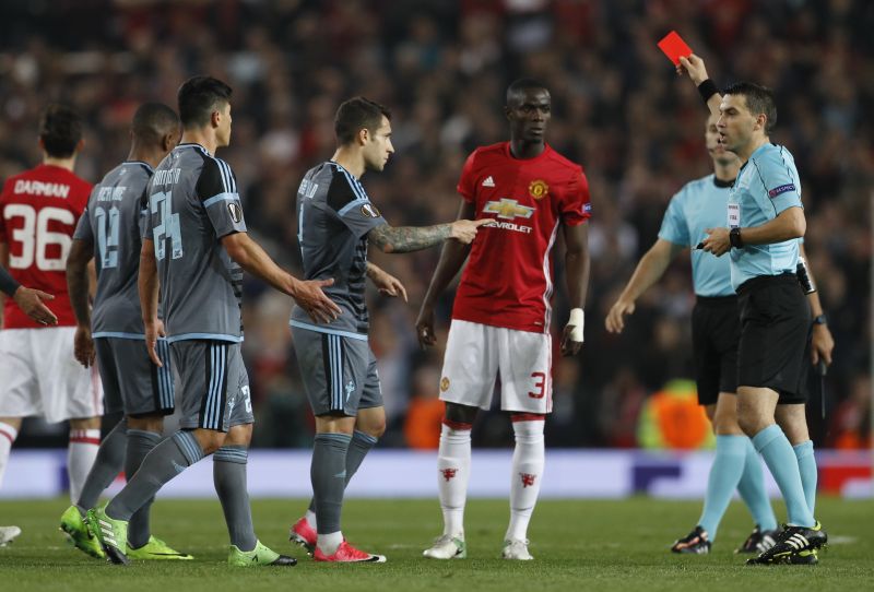 Manchester United's Eric Bailly and Celta Vigo's Facundo Roncaglia are both shown red cards by referee. u00e2u20acu2022 Reuters pic