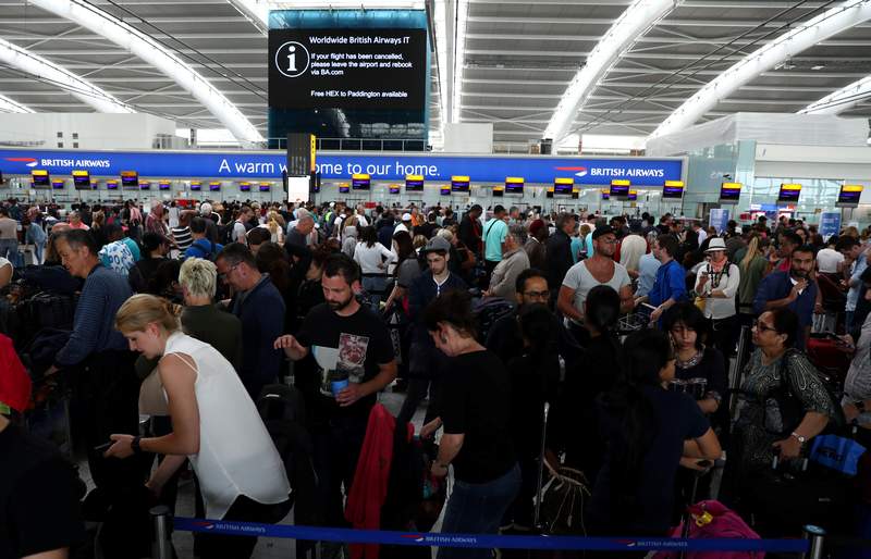 People wait with their luggage at the British Airways check in desks at Heathrow Terminal 5 in London May 28, 2017. u00e2u20acu201d Reuters pic 