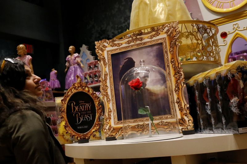 Customers look at u00e2u20acu02dcBeauty and the Beastu00e2u20acu2122 merchandise in a Disney Store in New York City May 9, 2017. u00e2u20acu2022 Reuters pic