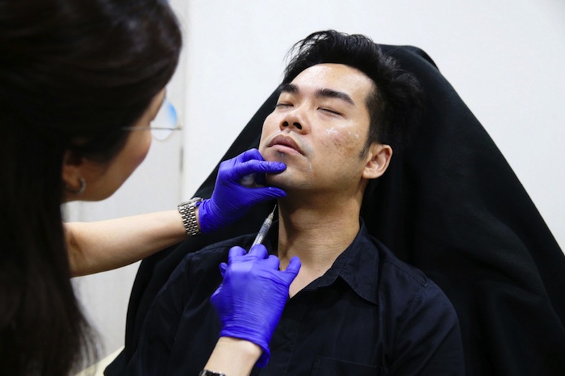 Film-maker Lincoln Chia undergoing an aesthetic procedure to enhance his chin at Ageless Medical Centre. u00e2u20acu201d Picture by Koh Mui Fongn
