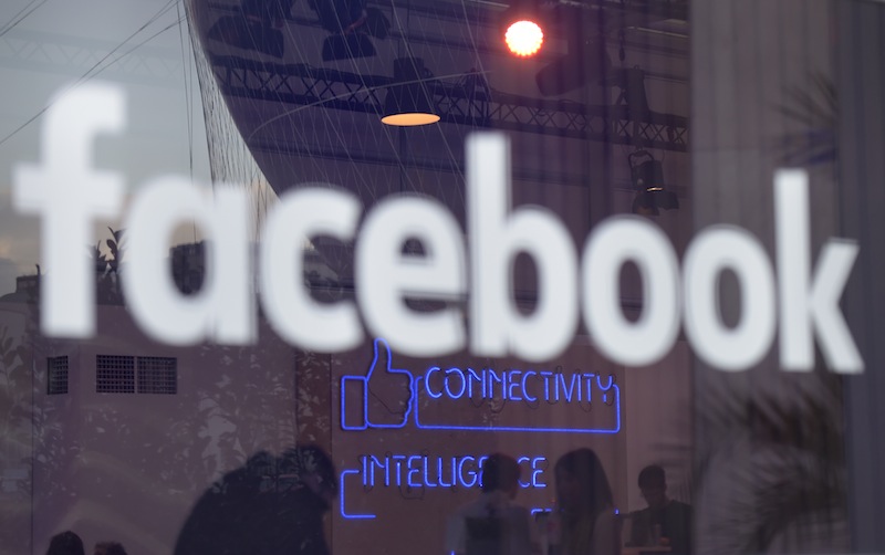 57 per cent of the online world has signed up to the world's largest social network. u00e2u20acu201d AFP pic