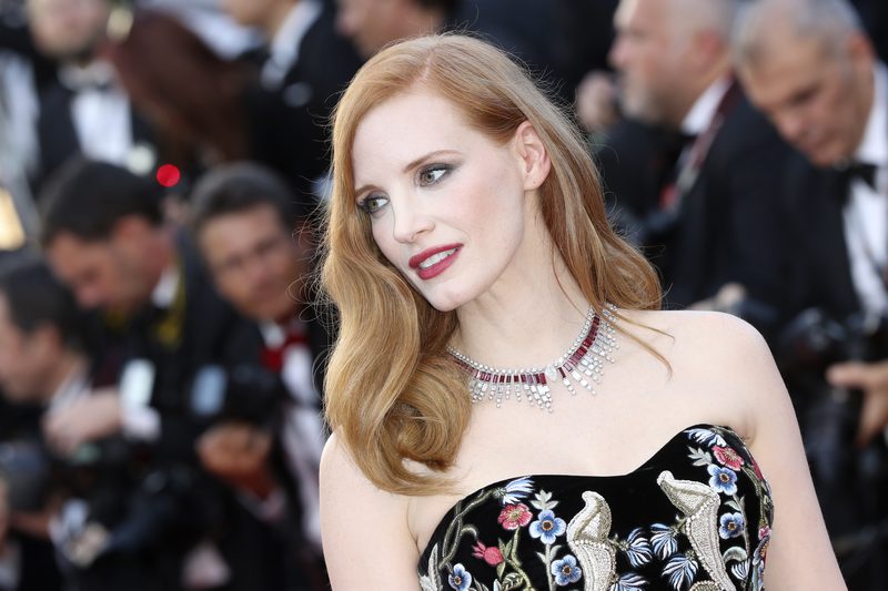 Jessica Chastain rocks the red carpet with shimmering eyes and a statement jewel-toned lip to match her richly embroidered Alexander McQueen gown and ruby-encrusted necklace, designed by Piaget. u00e2u20acu201d AFP pic