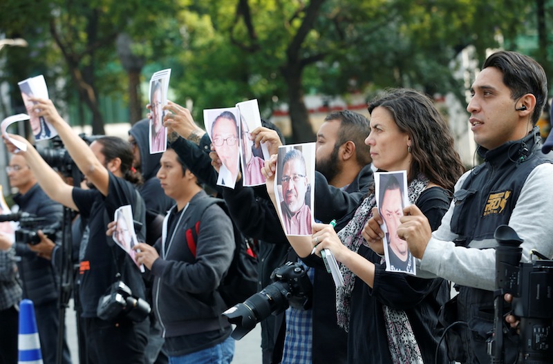 Journalists and photographers hold up pictures of Javier Valdez during a demonstration against his killing in Mexico, at the Angel of Independence monument in Mexico City, Mexico May 16, 2017. u00e2u20acu201d Reuters pic