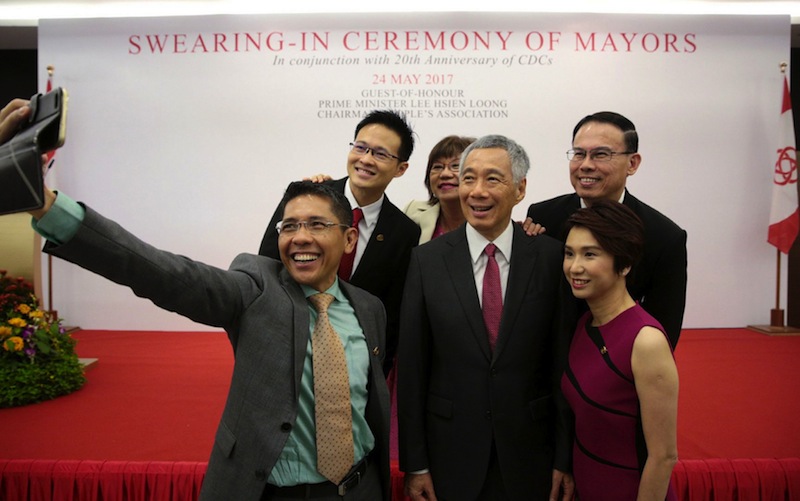 PM Lee with newly elected mayors (from left) Maliki Osman, Desmond Choo, Denise Phua, Teo Ho Pin and Low Yen Ling, during the swearing-in ceremony yesterday. u00e2u20acu201d Picture by Jason Quah