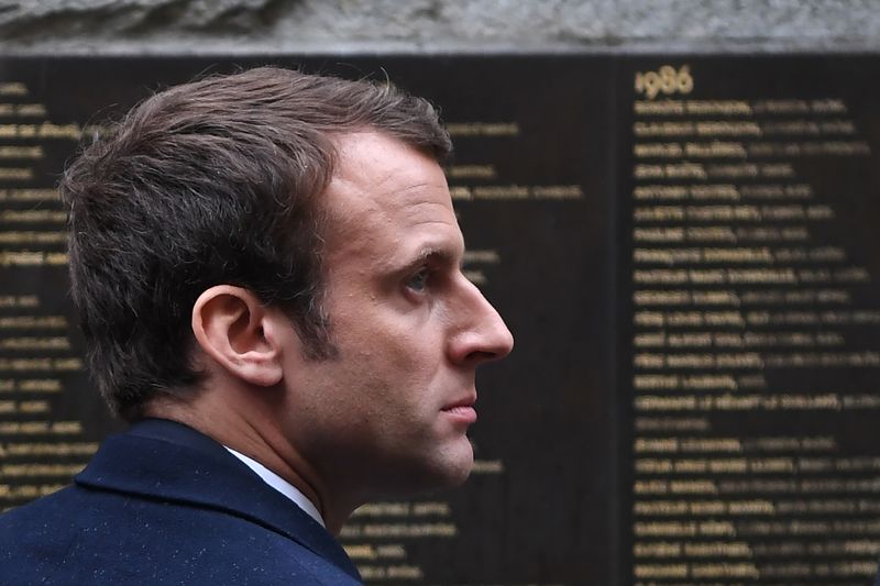 French presidential election candidate for the En-Marche movement, Emmanuel Macron stands by the Wall of the Righteous (Le Mur des Justes) during a visit to the Shoah Memorial on April 30, 2017 in Paris. u00e2u20acu201d AFP pic