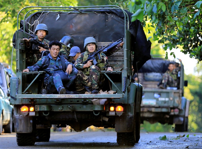 Government soldiers on military vehicles patrol after a continued assault on fighters from the Maute group who have taken over large parts of Marawi city, southern Philippines May 26, 2017. u00e2u20acu201d Reuters pic