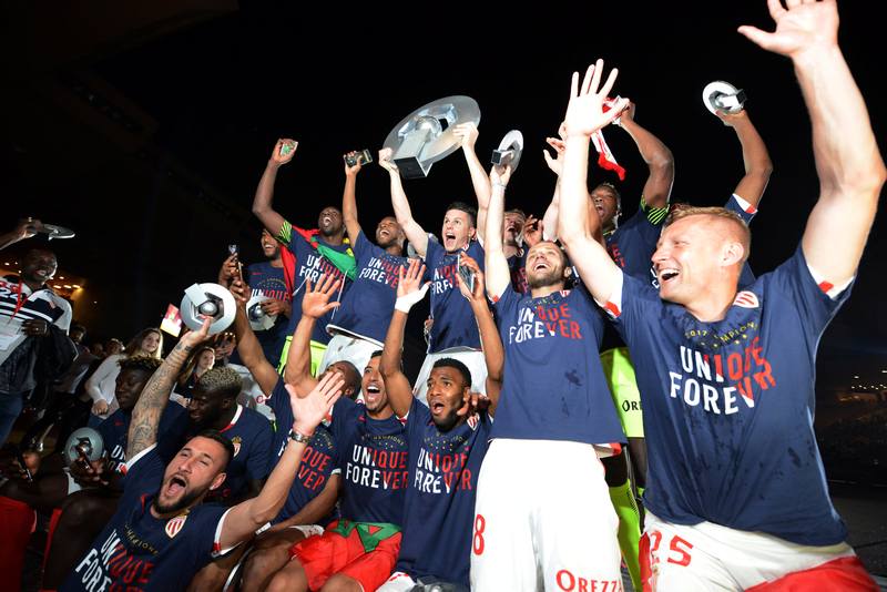 Monaco players celebrate with the trophy after winning Ligue 1 title with victory over Saint Etienne in Monaco May 17, 2017. u00e2u20acu201d Reuters pic