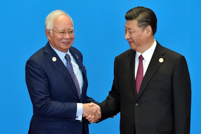 Malaysian Prime Minister Datuk Seri Najib Razak shakes hands with Chinese President Xi Jinping during the welcome ceremony for the Belt and Road Forum, at the International Conference Center in Yanqi Lake, north of Beijing, May 15, 2017. u00e2u20acu201d Reuters pic