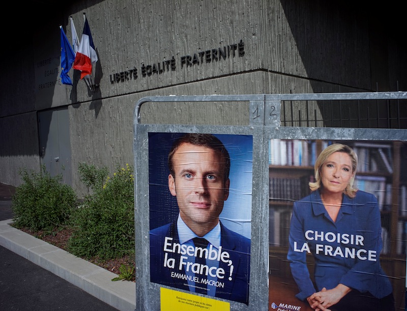New official posters for the candidates for the 2017 French presidential election, Emmanuel Macron (left) and Marine Le Pen are displayed in Fontaines-sur-Saone, near Lyon, France, April 30, 2017. u00e2u20acu201d Reuters pic 