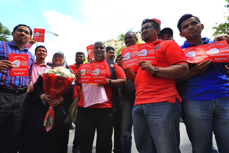 A week after the March 23 arrest of 79 anti-GST activists, PSM and other activists pressed the Customs Department to give full clarification on the tax, April 1, 2015. ― Picture by Saw Siow Feng