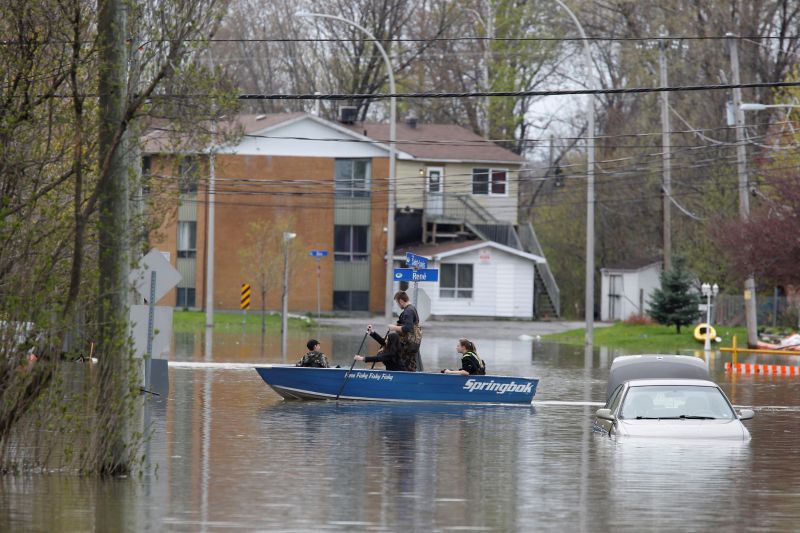 People row a boat on a flooded residential street in Gatineau, Quebec May 4, 2017. u00e2u20acu201d Reuters pic