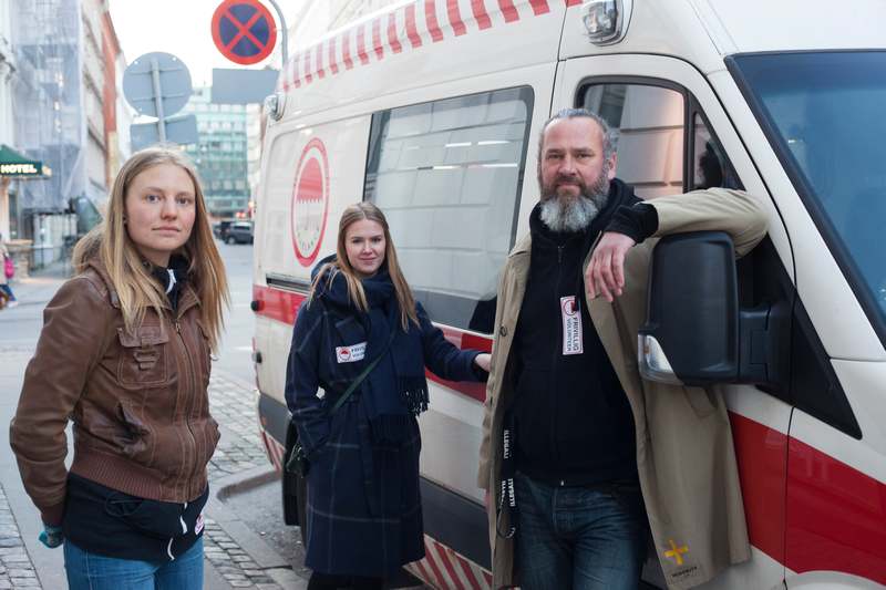 Michael Lodberg Olsen (right) and two volunteers Astrid Graugaard Jepsen (left) and Lea Olsen with the 'Sexelance,' a repurposed ambulance in Copenhagen April 18 2017. — Reuters pic