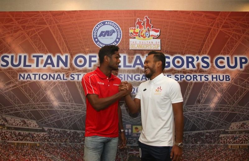 Singapore Selection's Hariss Harun sharing a laugh with Safee Sali of the Selangor Selection at the press conference. u00e2u20acu201d Handout via TODAY
