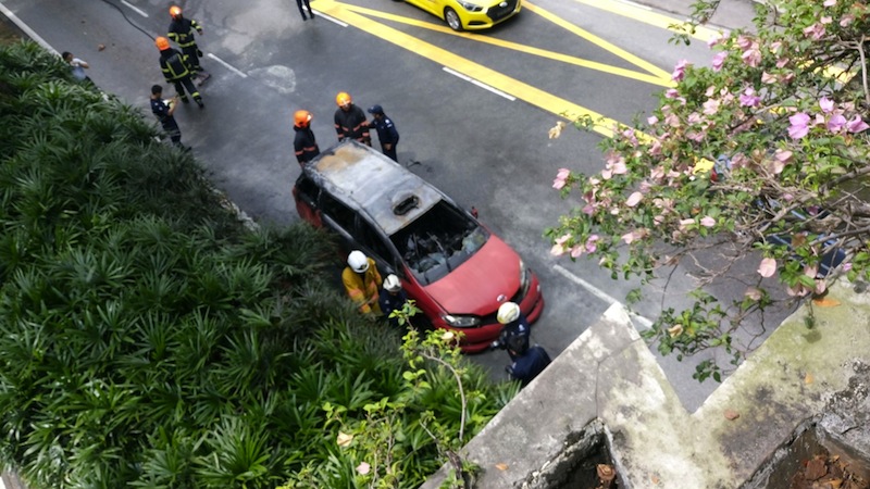 The Trans-cab taxi which caught fire on Monday afternoon along Marymount Road. u00e2u20acu201d Picture by Faris Mokhtar/TODAY
