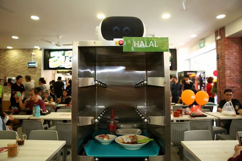 A tray-return robot goes around Happy Hawkers for customers to return their trays once they are done with their meals. u00e2u20acu201d TODAY pic