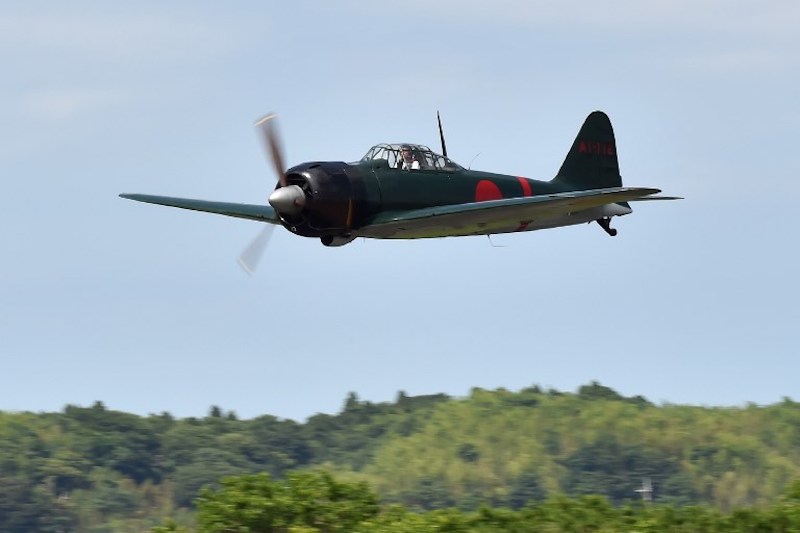 A restored World War II-era Mitsubishi A6M Type 22 Zero fighter flies over an airfield in Ryugasaki, Ibaraki Prefecture, June 9, 2017. u00e2u20acu201d AFP pic
