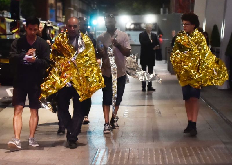 u00e2u20acu201d People leave the area wearing foil blankets after an incident near London Bridge in London, Britain June 4, 2017. u00e2u20acu201d Reuters pic
