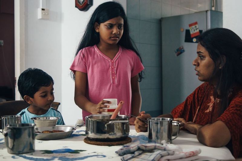 Child actress Vinathi Naidu (centre), who plays the titular character in Azza, seen with other members of the cast in this behind-the-scenes photo. u00e2u20acu201d Picture by Reynard Lee via Nur Shahidah
