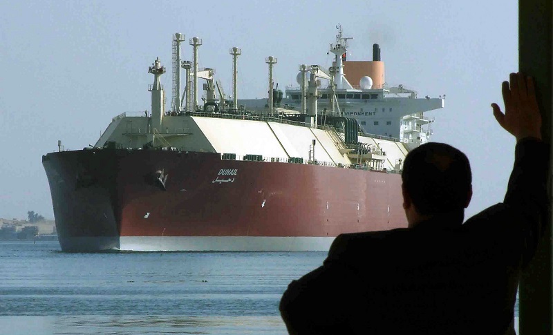 File picture shows a man looking as the worldu00e2u20acu2122s biggest Liquefied Natural Gas (LNG) tanker, Qatari-flagged DUHAIL as she crosses through the Suez Canal April 1, 2008. u00e2u20acu201d Reuters pic