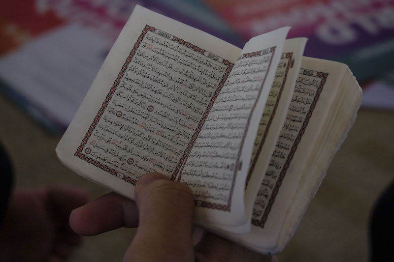 A young Muslim reads the Quran during the World Quran Hour programme at Masjid Tuanku Mizan Zainal Abidin in Putrajaya, June 19, 2017. u00e2u20acu201d Picture by Yusof Mat Isa