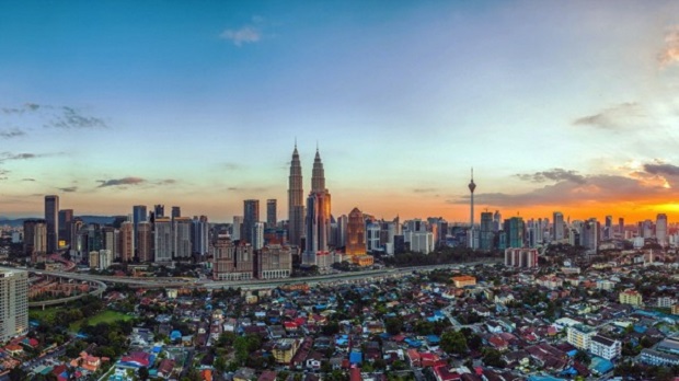 Sprawling Kampung Baru against the backdrop of the Golden Triangle, including the Petronas Twin Towers and KL Tower. u00e2u20acu201d Picture by Malay Mail