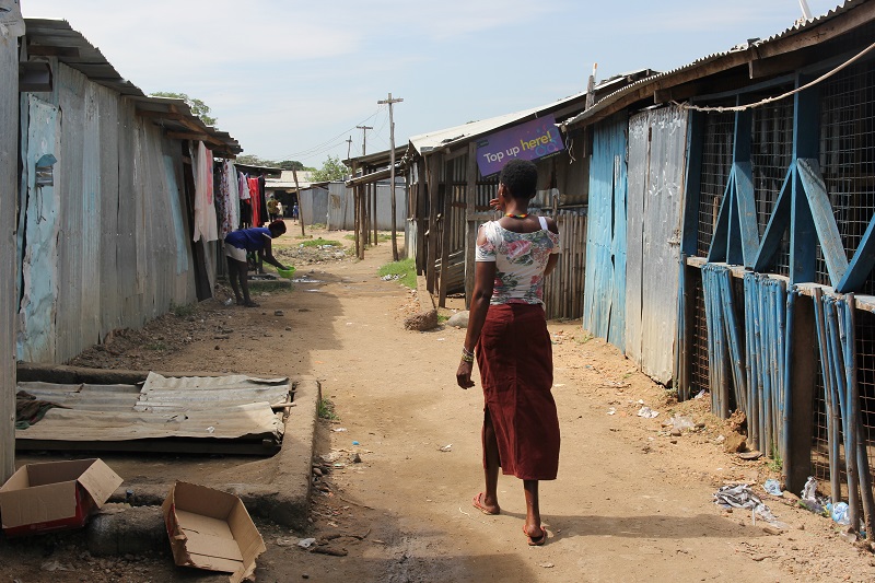 A sex worker walks down an alley in Gumbo, a red light district in South Sudanu00e2u20acu2122s capital Juba on April 19, 2017. u00e2u20acu201d picture by Thomson Reuters Foundation/Stefanie Glinski via Reuters