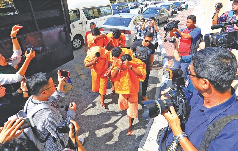 The suspects involved in brain dead teen T. Nhaveen's case being taken to court to have their remand extended in Penang June 13, 2017. u00e2u20acu201d Picture by Sayuti Zainudin