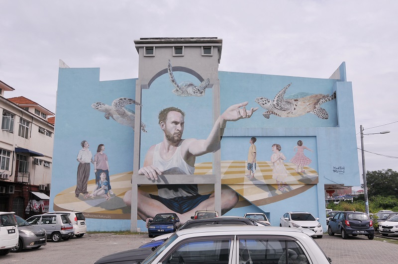 Martin Ron’s surreal mural facing a carpark at the Taman Perusahaan Raja Uda. 