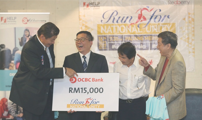 Jeffrey Teoh (second from left) shares a light moment with Siew, Kurup and Chan after announcing OCBCu00e2u20acu2122s participation as a sponsor in the Run for National Unity 2017. u00e2u20acu201d Malay Mail pic