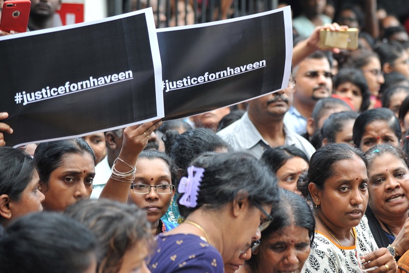 Family members and relatives demanding for justice for T. Nhaveen at the funeral today. u00e2u20acu201d Picture by KE Ooi