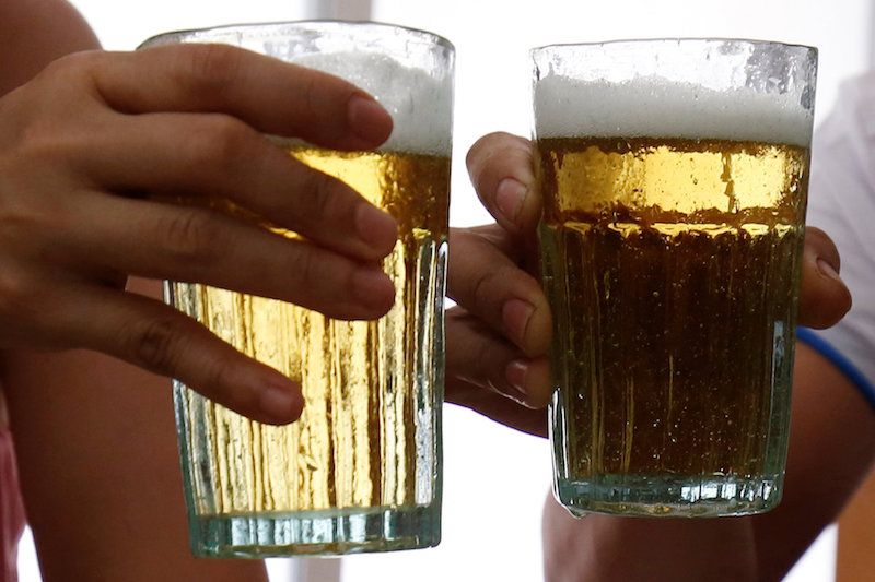 Customers hold glasses of draught beer at a restaurant in Hanoi June 24, 2017. u00e2u20acu201d Reuters pic